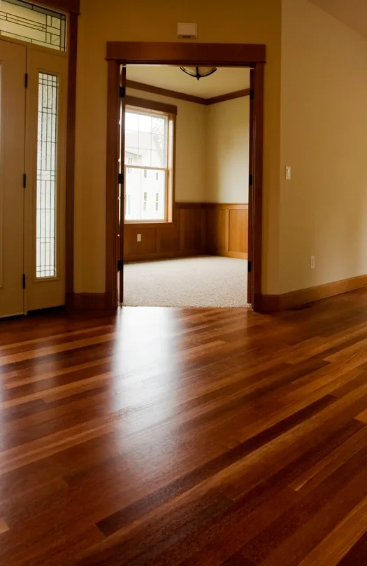 Hallway with glossy hardwood flooring