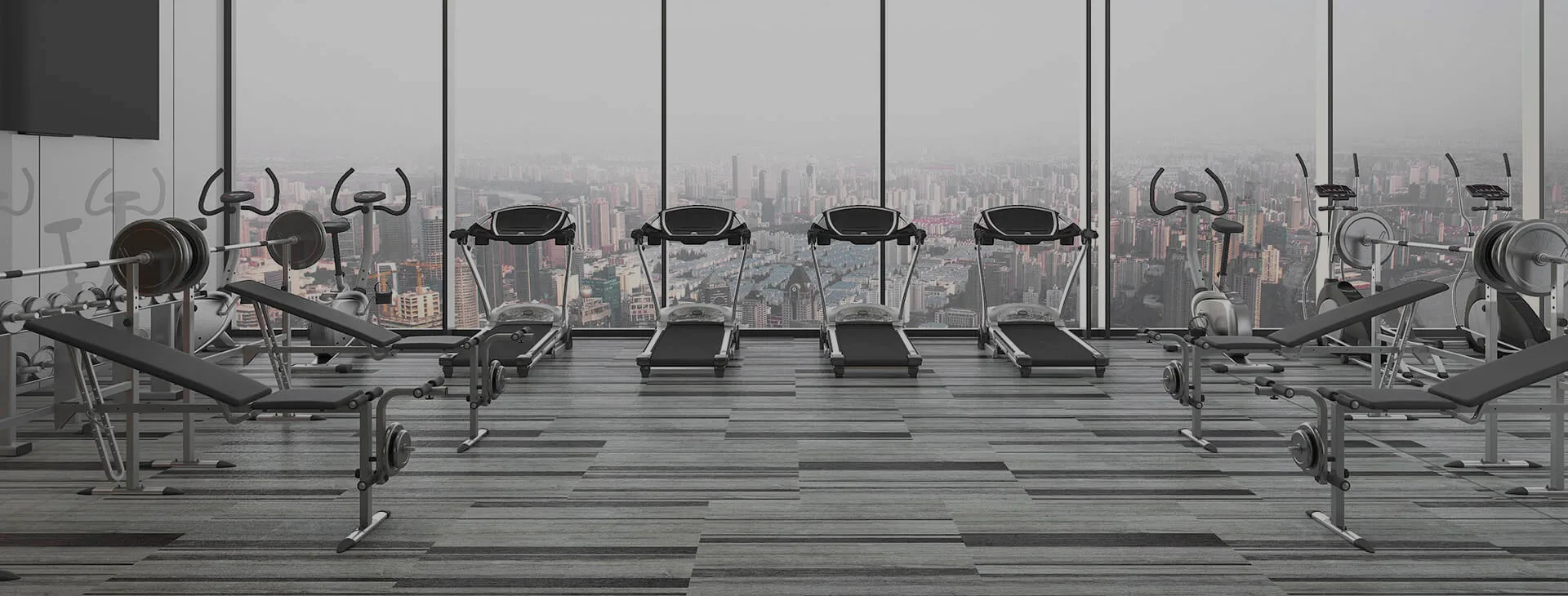Fitness studio with grey vinyl plank floor and cardio machines